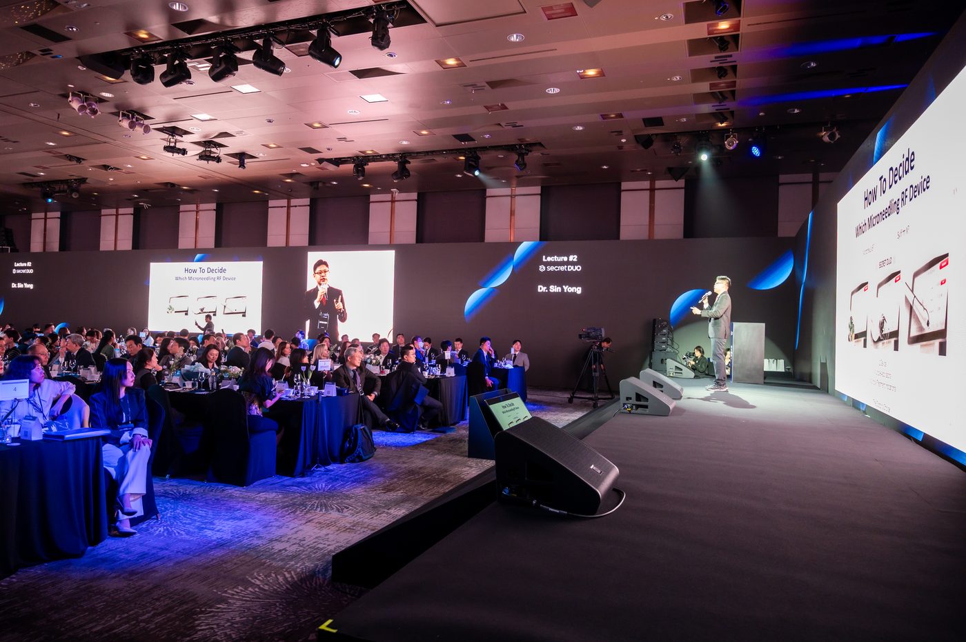 Dr. Sin Yong on stage with the host at the CLASSYS Global Customer Summit 2025, Seoul